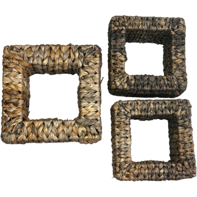 A sculptural set of three vintage square wall shelves featuring richly textured woven natural fibers over sturdy internal...