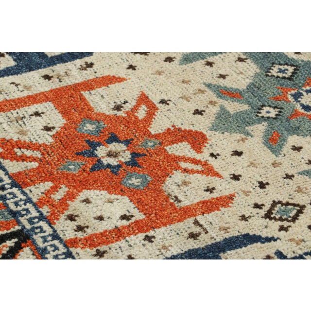 Hand-knotted in wool, this 2x3 classic oriental rug from India presents a striking blend of geometric and tribal motifs...