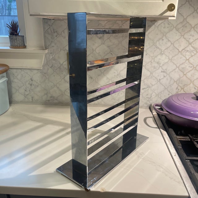 A striking and highly functional sculptural jewelry stand crafted in polished chrome-finished metal. This substantial...