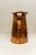 An antique late 18th to early 19th century hammered copper measure or pitcher with an approximate 4-liter capacity....