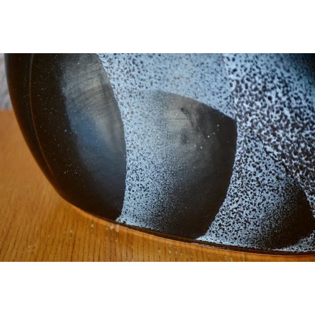 with its particular enamel, an airbrush dumping on a shiny black background, this old German vase is a piece of choice!...