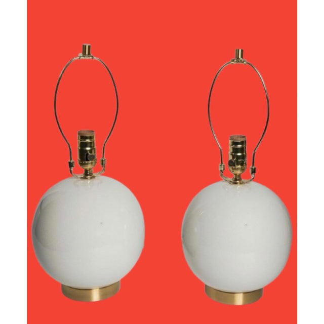 Classic Ralph Lauren table lamps, white ceramic & brass sign at the base. Timeless style, perfect with many decor.