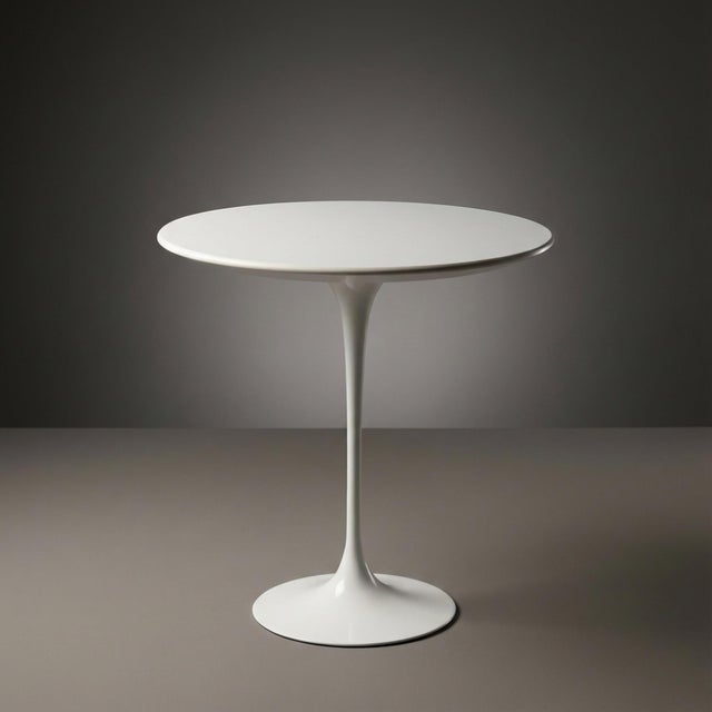 At a Glance: - This is perhaps one of Eero Saarinen’s most iconic designs, in the easiest to enjoy form-factor. - White on...