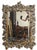 A large Continental rectangular beveled glass mirror with a very ornate grapevine frame of hand-carved wood - in the Black...