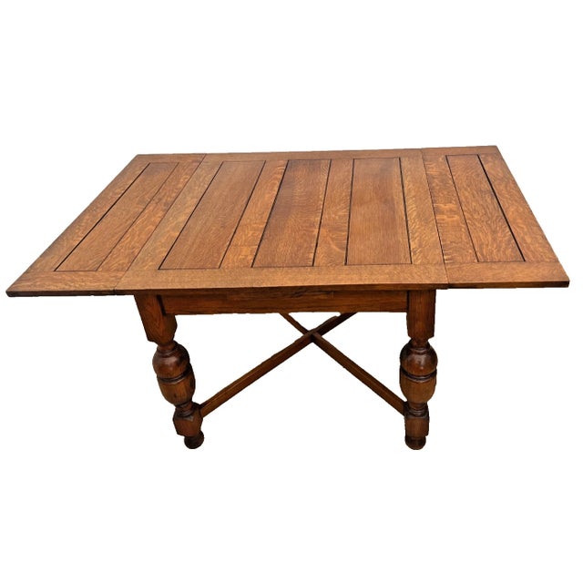 Bring timeless character to your dining space with this exceptional antique extension table, masterfully crafted from...