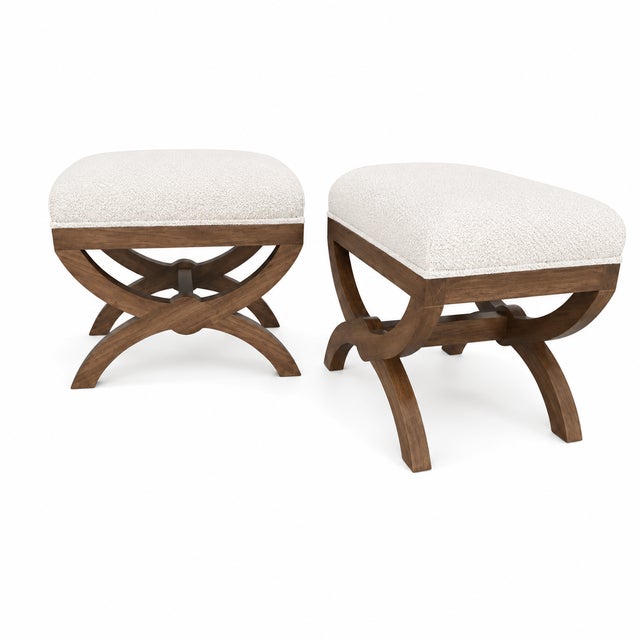 Modern pair of ottomans. The set is done in a modern white Boucle . The finish is walnut. The frames are made of alder.....