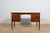 This desk was made in Denmark in the 1960s. The desk is made of teak wood and is free-standing thanks to the finished back...
