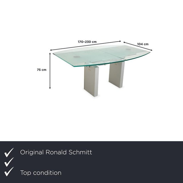 The Ronald Schmitt K5000 glass dining table combines modern design with sophisticated functionality. The tabletop measures...