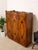 A truly unusual vintage Art Deco wardrobe combining richly figured burl wood with dramatic hand-painted botanical motifs...