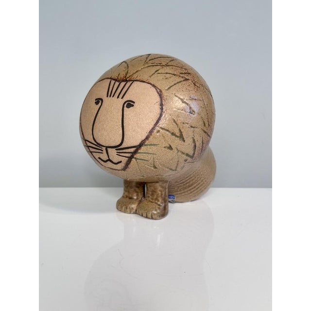 This stoneware lion is from the Africa series designed in 1964 by the renowned ceramic artist Lisa Larson (1931-2024) for...