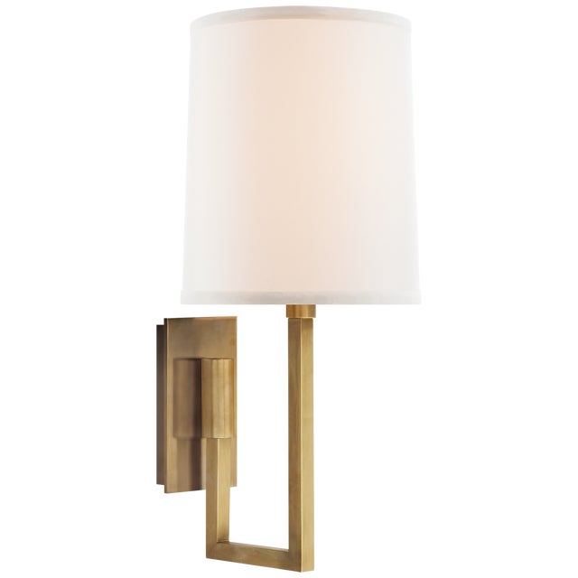 Aspect Library Sconce in Soft Brass with Ivory Linen Shade Designer: Barbara Barry Height: 14.5" Extension: 7.5"...
