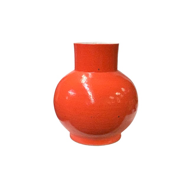 Discover the radiant charm of an orange glaze bulb shape pottery art vase. Inspired by Scandinavian design, this eye-...