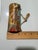 A Rare Miniature Masterpiece This exquisite 5”x2” hand-painted roof tile captures the vast beauty of a colonial village in...