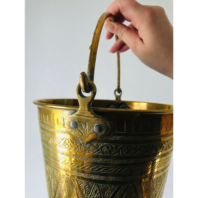 Originally used as a water bucket (we think!), this vintage brass bucket is detailed with an elegant etched pattern and...