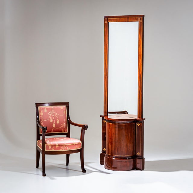 Biedermeier pier mirror with matching wall console. The mirror is veneered in mahogany and framed with delicate maple...