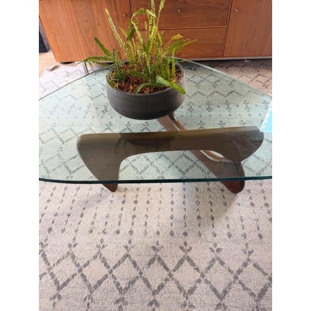 Iconic Isamu Noguchi IN-50 coffee table, originally designed in 1944 and produced under license by Herman Miller. One of...