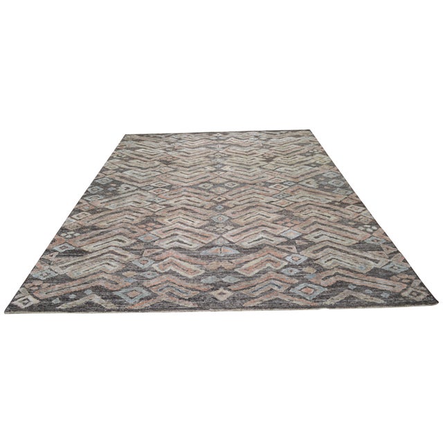 Hand-knotted with care using traditional rug making techniques, this wool rug blends timeless craftsmanship with a modern...