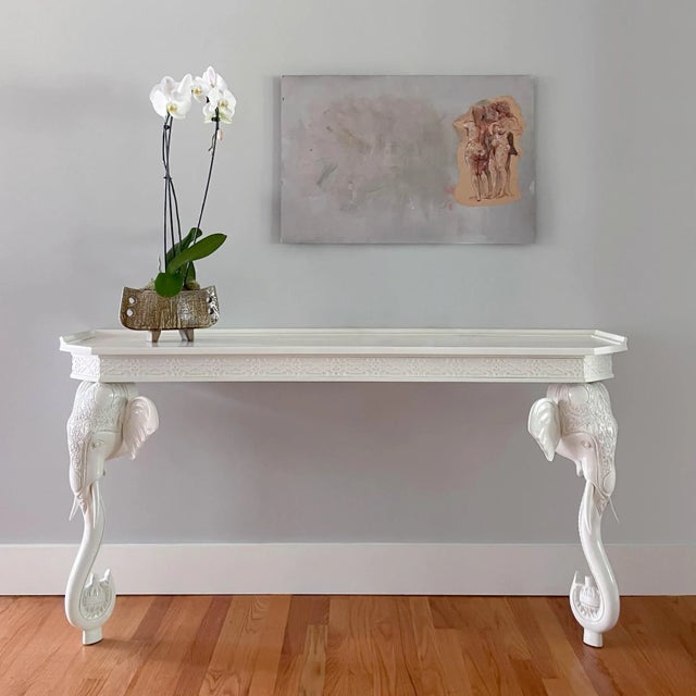 Stunning hand carved wood wall mount console table by Gampel Stoll featuring a fretwork border and decorative elephant...