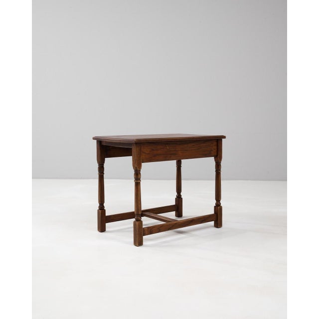 20th century Belgian wooden coffee table retaining its beautiful original patina, a testament to the quality and...