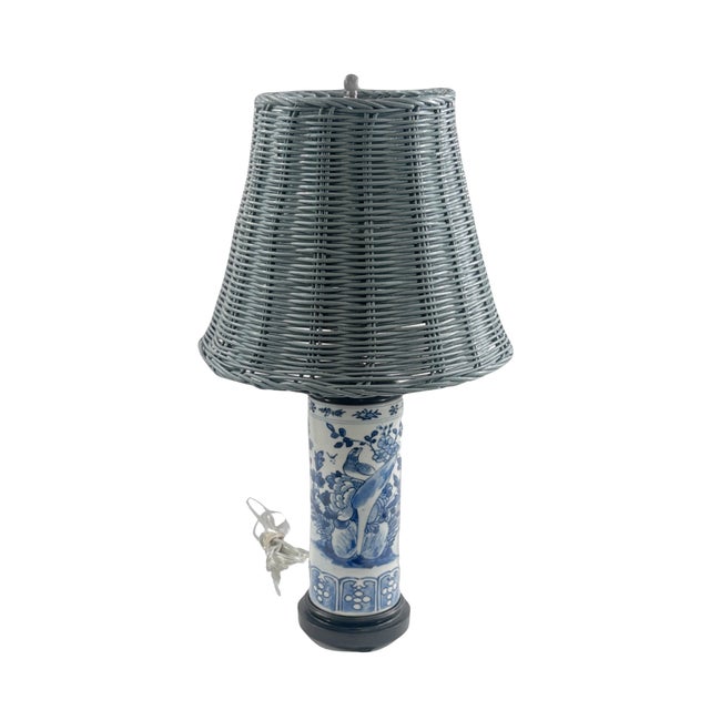 Vintage Blue and white ceramic lamps, each are depicting a floral, leaf and butterfly detail. Lamps each have black toned...