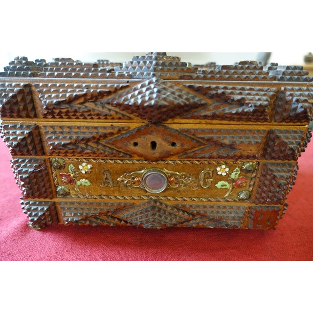 Superb example of a particularly well-crafted Tramp Art box. Probably a wedding box with portraits of the bride and groom....