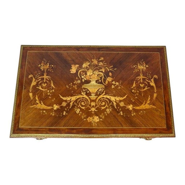 This striking antique Louis XVI style table, dating to approximately 1890, exemplifies the refined elegance of French...