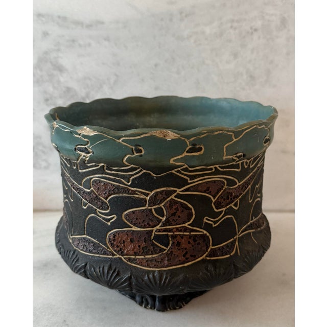 Beautiful antique carved hand made art pottery with a scalloped edge, wonderful glazing and texture and muted green and...
