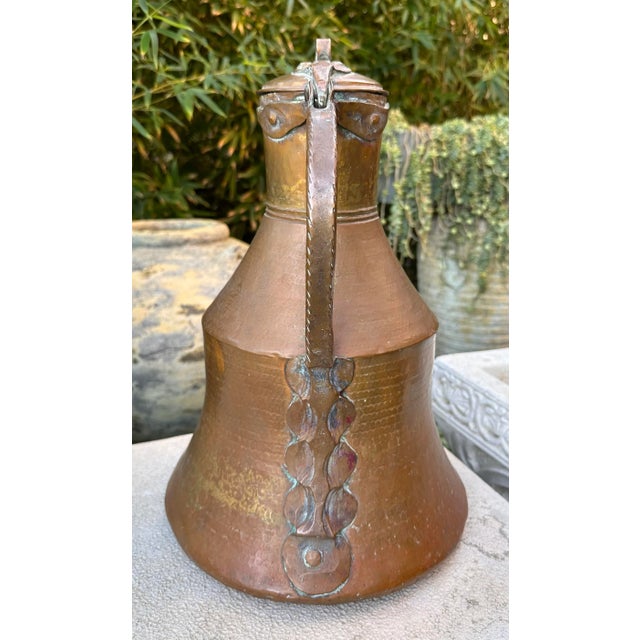 Antique 19th century Large Hammered Copper lidded jug pitcher ewer. Hand hammered copper jug water ewer pitcher has a...