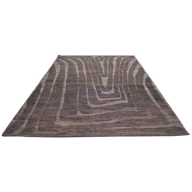 Hand-knotted with care using traditional rug making techniques, this wool rug blends timeless craftsmanship with a modern...