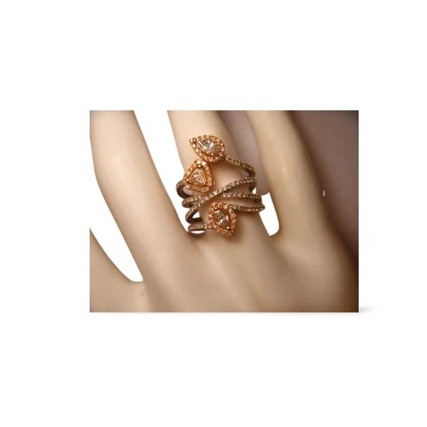 18K white and pink gold designer ring featuring 3 fine diamonds (0.6 ct) and 129 pave--set diamonds (0.7ct) in a bold wide...