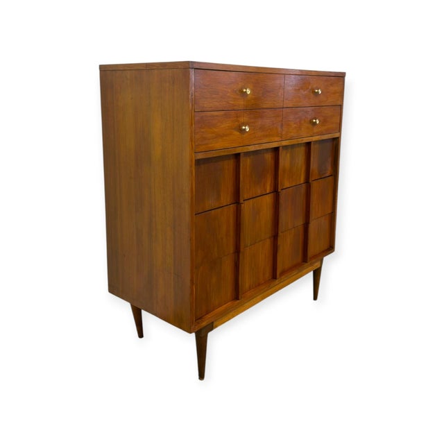 This authentic Mid-Century Modern highboy dresser by Basic Witz features a warm wood tone finish and classic MCM design...