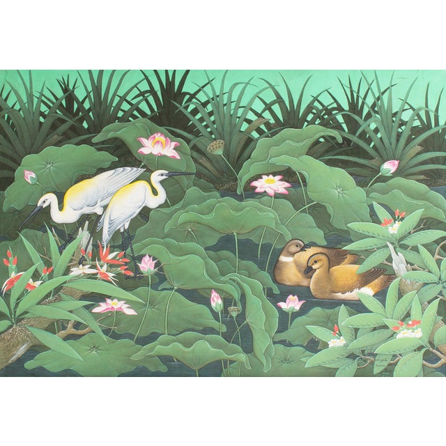 A painting by the Balinese artist W. Kuparyadi. This highly detailed work depicts a lotus pond with various birds. Signed...