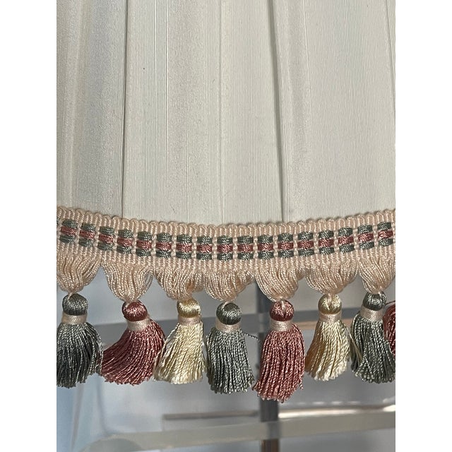 Vintage white pleated lamp shade with tasselated fringes.