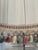 Vintage white pleated lamp shade with tasselated fringes.