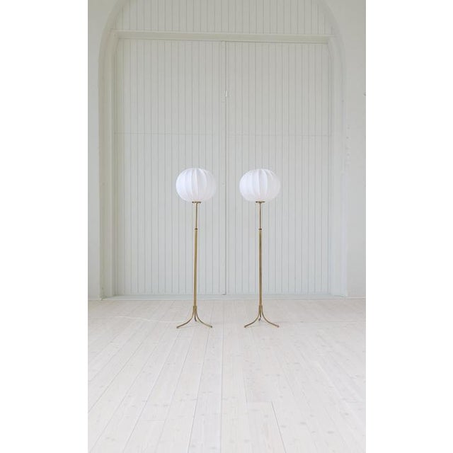 These rare height adjustable brass floor lamp model G2326 was designed by Josef Frank and produced by Svenskt Tenn in...