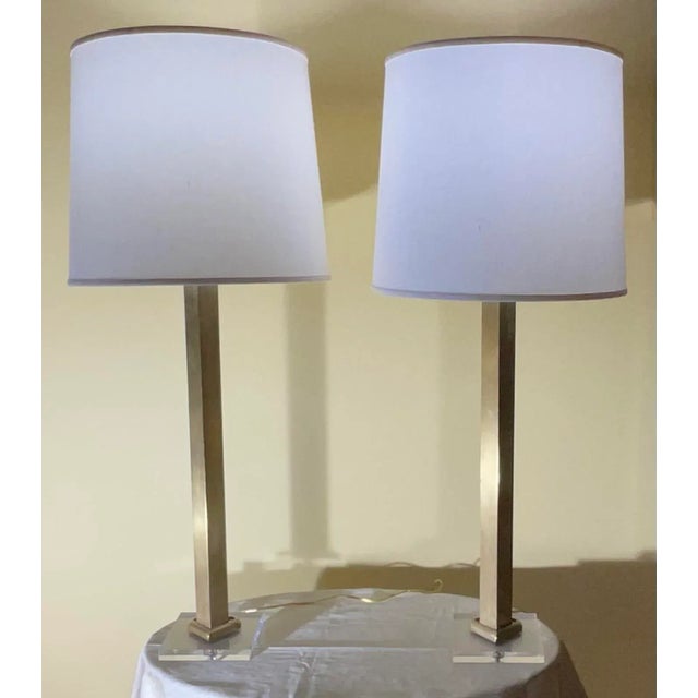 This stunning pair of vintage table lamps showcases the iconic design aesthetic of Karl Springer made of solid brass, with...