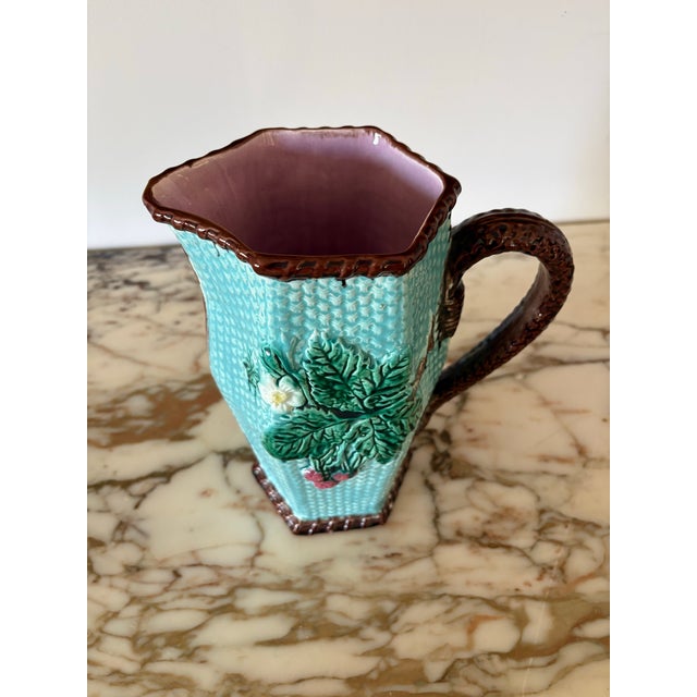 Glazed Majolica pitcher in gorgeous basketweave pattern in dreamy turquoise with beautiful raised berry design on both...