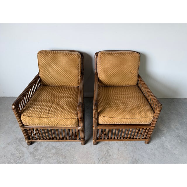Vintage Palecek President’s State lounge chairs crafted from pencil pole stick rattan with hand-wrapped details and...