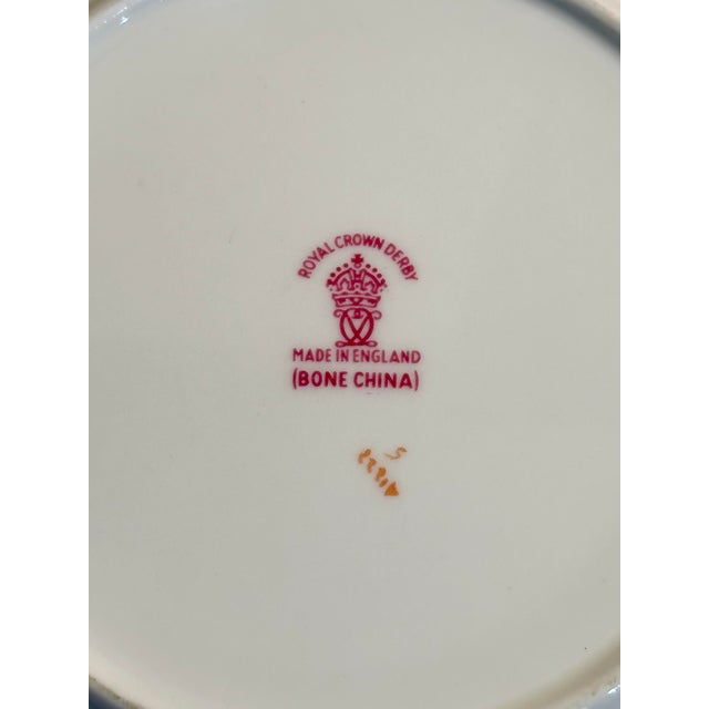 An elegant 30-piece Royal Crown Derby Marquis dinner service for six in the desirable Beaufort shape, produced in England...