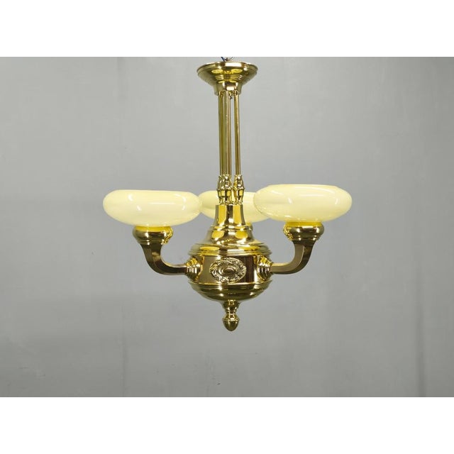 Elegant neoclassical art deco chandelier produced in czechoslovakia during the 1930s. This sophisticated ceiling fixture...