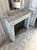 Late 19th C. French Louis XVI style carved wood boiserie featuring mantel and mirror with flanking pairs of doors. This...