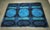 Large-scale Danish Rya rug showcasing a bold abstract geometric design rendered in rich shades of cobalt blue, turquoise,...
