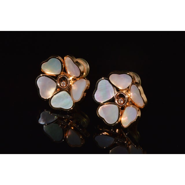Authentic Chopard Happy Hearts Flowers natural diamond, mother-of-pearl and solid 18K rose gold clip earrings. These...