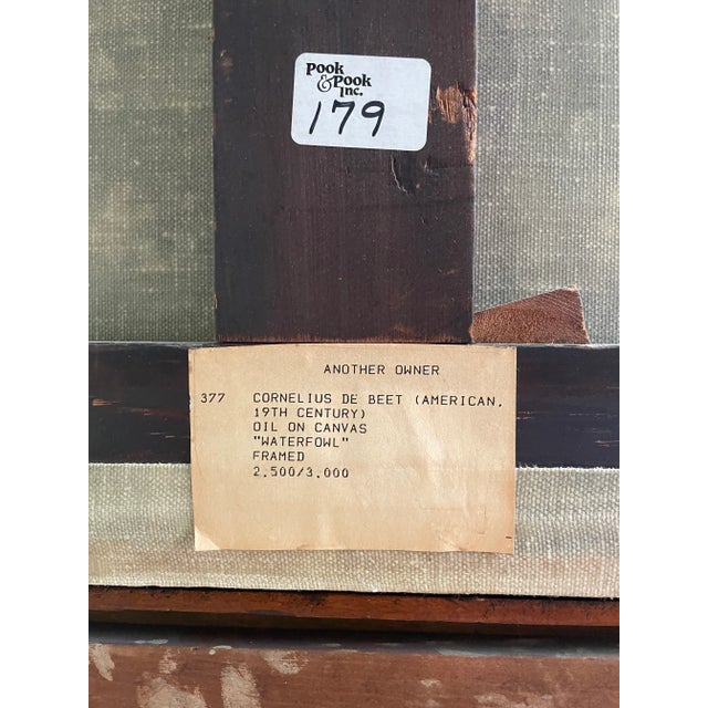 A 24" x 29" scene of a hawk looming over several ducks is the subject of this oil on canvas. Attributed to Cornelius De...