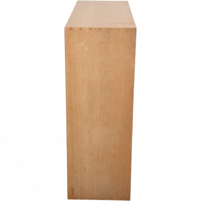 Mogens Koch bookcase made of oak. The bookcase is from the 1980s and appears with some marks and scratches. •Designer:...