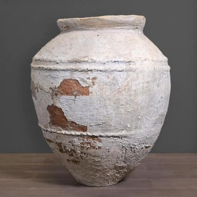 This monumental water jar from Java is an authentic 19th-century terracotta vessel, traditionally used for storing food or...