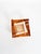 Vintage French ashtray dating from the 1960s, crafted from thick molded glass in a warm red-orange tone. Its compact...