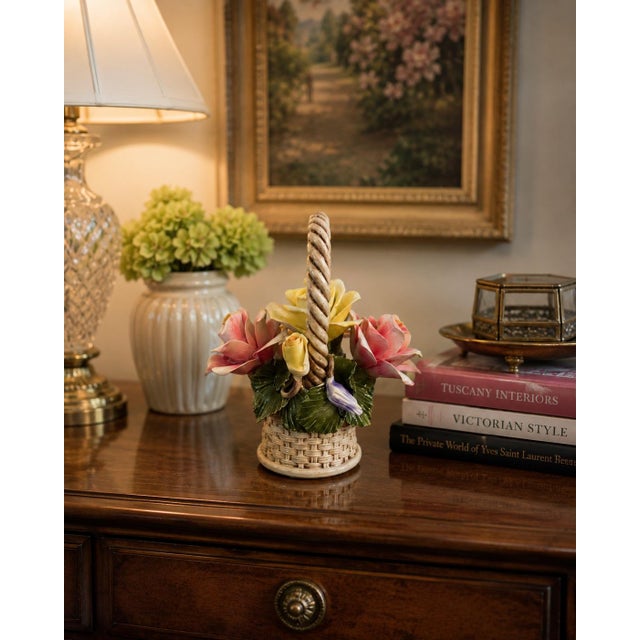 Striking vintage Italian Capodimonte porcelain floral basket featuring an elaborate sculptural arrangement of hand-modeled...