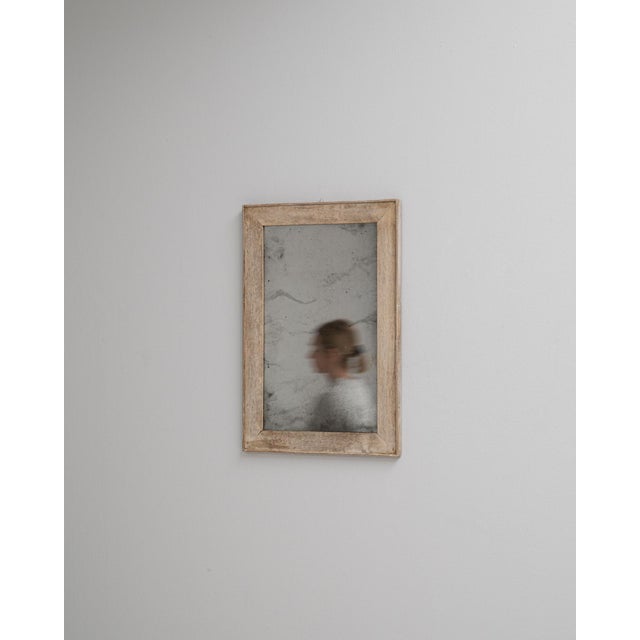 This 1900s French oak wall mirror offers a simple yet authentic expression of early 20th-century craftsmanship. The frame...