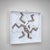 Pair of square wall objects made of white-glazed and enameled ceramic, featuring deeply recessed frames. The central...